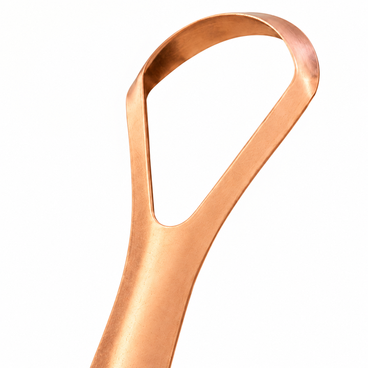 Copper tongue scraper, close-up of the looped head folded from a single band of copper