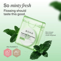 Dispenser surrounded by fresh mint leaves, showing the Ela Mint flavour label